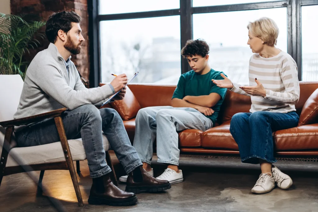 Family counselling session in a bright living room